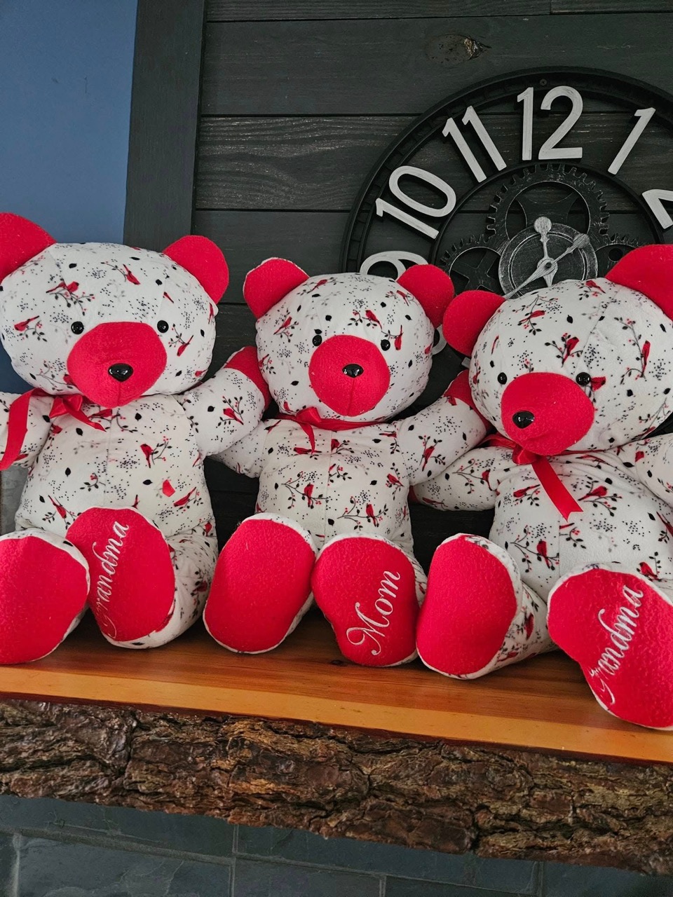 Three memory keepsake bears sewn from cardinal-print fabric, embroidered with Grandma and Mom on the feet, by Bad Grammy's Creations